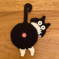 Niedliche gestrickte Kätzchen-Hintern-Untersetzer