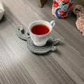 Niedliche gestrickte Kätzchen-Hintern-Untersetzer