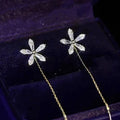 Glänzende Blumenohrringe mit Fransen