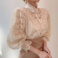 Bluse mit hohlem Blumenmuster und Stehkragen