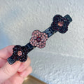 Seitliche Haarspange mit drei Blumen