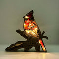 Aus Holz geschnitzte Tierornamente (mit Lichtern)